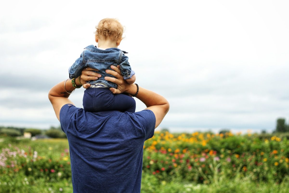 baby-sitting-on-man-s-shoulder-1497394